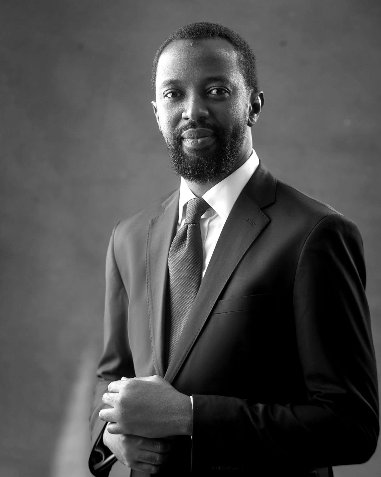 Portrait of Dr. Anas Balarabe Yazid in a dark suit and tie